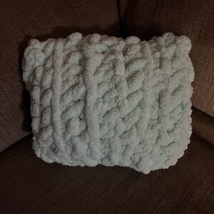A very soft and squishy crocheted pillow. Perfect for nurseries or for kids!